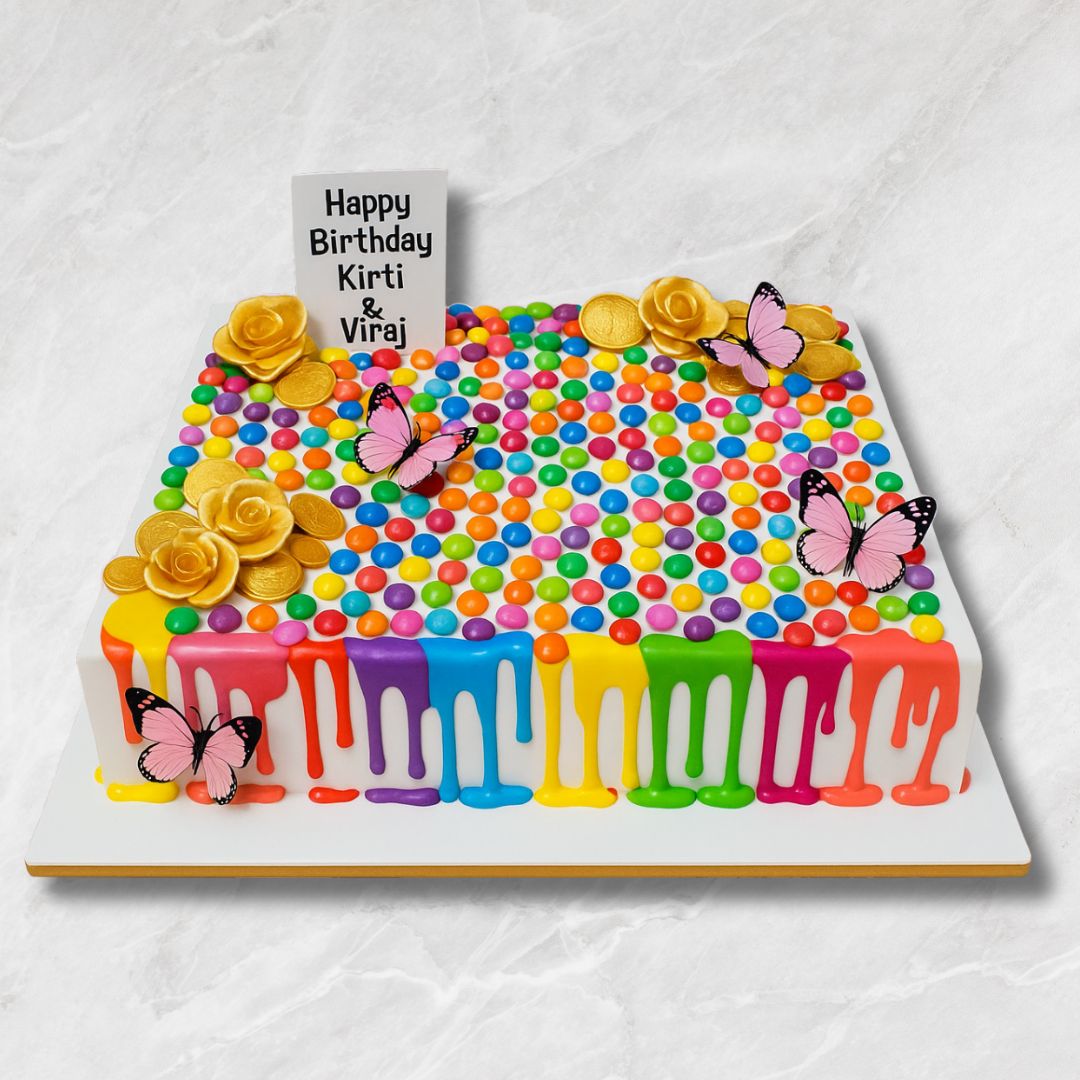 Rainbow Candy Drip Cake with Butterflies & Gold Coins
